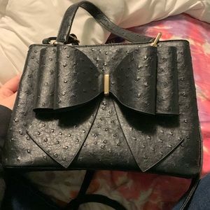 Black purse with bow on the front!